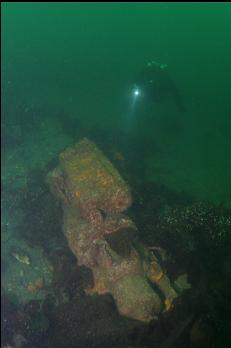 ENGINE ON OLD WOODEN HULL BOTTOM