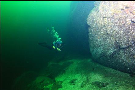 at the base of the wall 110 feet deep