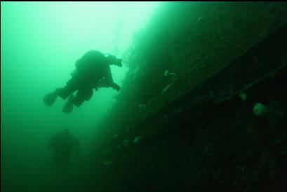 divers and access hole in hull
